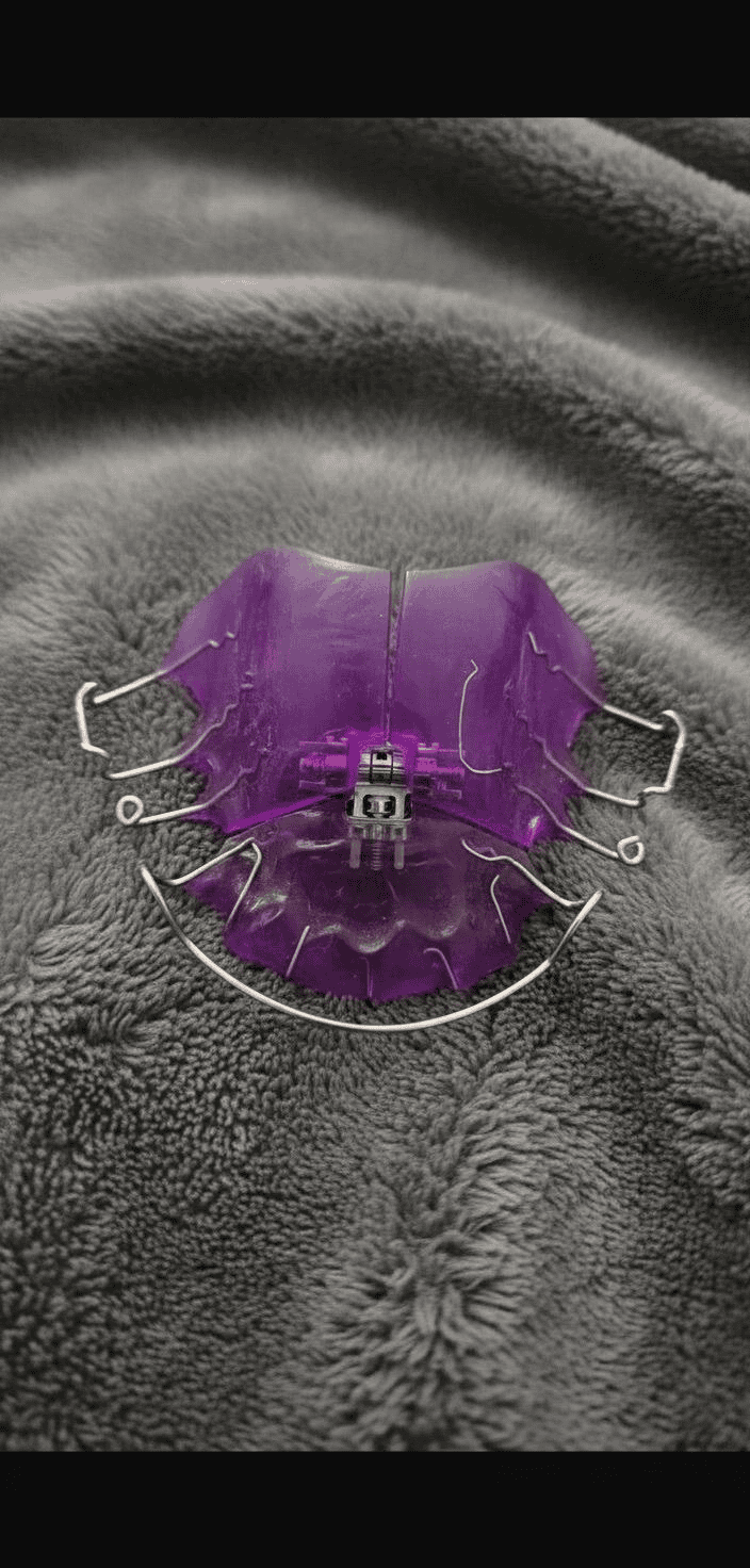 Purple appliance photographed on a grey blanket