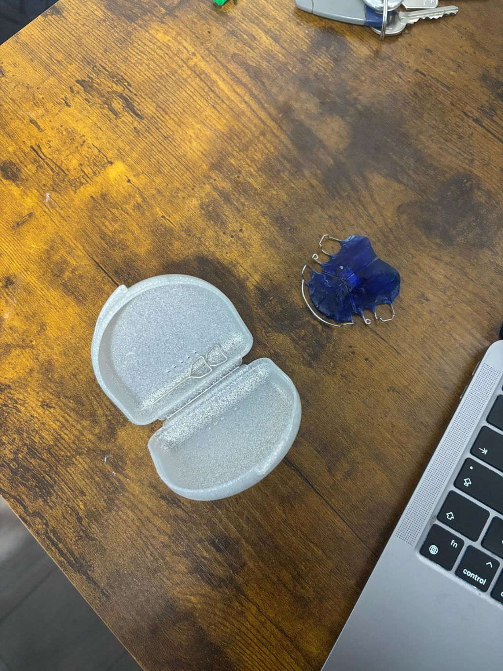 Blue appliance and case on a wooden desk